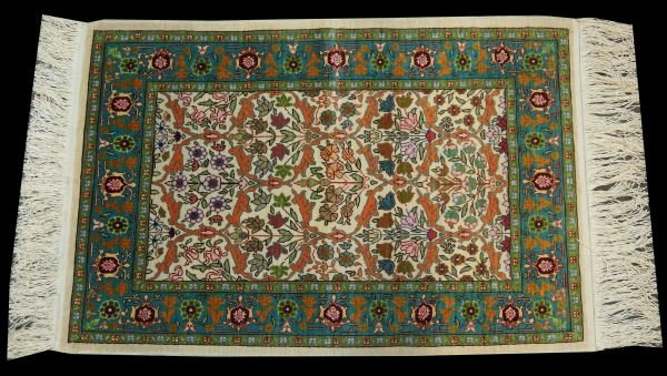 HANDMADE TURKISH HEREKE SILK RUG: HANDMADE TURKISH HEREKE SILK RUG. COMES WITH PAPER WORK. Height: 2 ft. 6 in. by Width: 1 ft. 8 in.