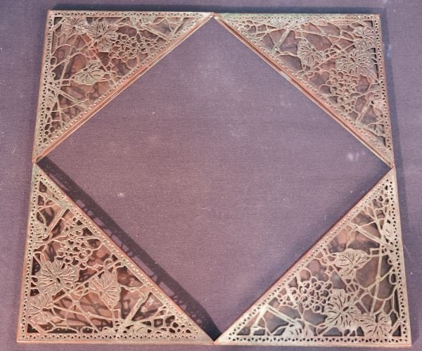 LOT OF FOUR TIFFANY ART NOUVEAU DESK PAD CORNER PIECES: LOT OF FOUR COPPER PATINAED ART NOUVEAU DESK PAD CORNER PIECES BY TIFFANY STUDIO, NEW YORK. Height: 6 in. by Width: 4 1/2 in.