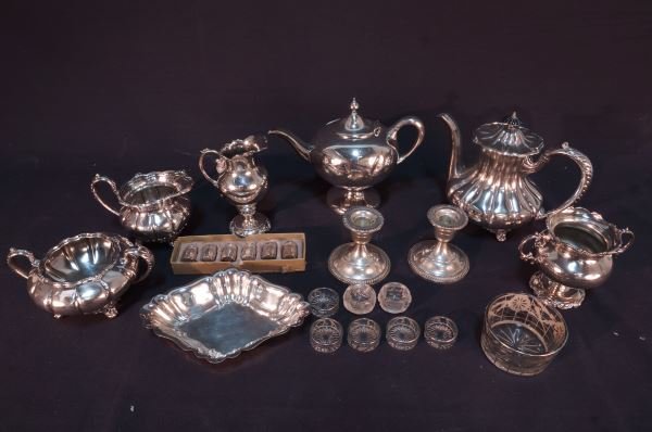 MIXED LOT OF TWENTY THREE PIECES OF SILVER: MIXED LOT OF TWENTY THREE PIECES OF SILVER. FISHER STERLING SILVER WEIGHTED CANDLESTICK HOLDERS, SIX SETRLING SILVER SALT & PEPPER SHAKERS. Height: 7 1/2 in. by Width: 9 in. by Depth: 6 in.