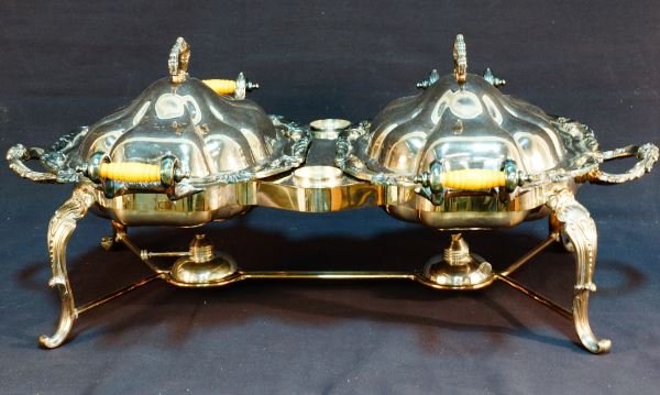 SILVERPLATED DOMED LID DOUBLE SERVING DISH: SILVERPLATED DOMED LID DOUBLE SERVING DISH WITH BARQUE SCALLOPED EDGE WITH DOUBLE STERNO BURNERS. . Height: 8 in. by Width: 28 in. by Depth: 18 1/2 in.