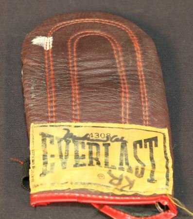 SIGNED SPARRING GLOVE BY MUHAMMAD ALI: SIGNED SPARRING GLOVE BY MUHAMMAD ALI Height: 10 in. by Width: 5 in.
