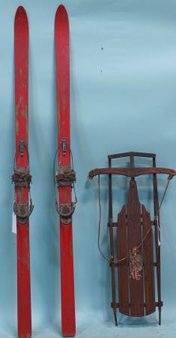 PAIR OF ANTIQUE SNOW SKIS AND A SLED: PAIR OF ANTIQUE SNOW SKIS AND A SLED.