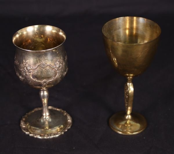 TWO STERLING SILVER CHALICES: TWO STERLING SILVER CHALICES. TOTAL WEIGHT: 1 LB. 0.4 OZ. Height: 6 1/2 and 7 in. by Width: 3 1/2 and 3 1/2 in.