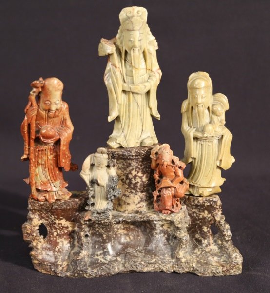 CARVED SOAPSTONE BASE WITH FIVE FIGURES: CARVED SOAPSTONE BASE WITH FIVE FIGURES. Height: 7 in. by Width: 11 in. by Depth: 2 1/2 in.