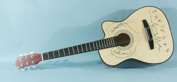 ACOUSTIC GUITAR AUTOGRAPHED BY BAD BLAKE: ACOUSTIC GUITAR AUTOGRAPHED BY BAD BLAKE ALSO SIGNED BEAU BRIDGES. Height: 38 in. by Width: 14 1/4 in. by Depth: 3 1/2 in.