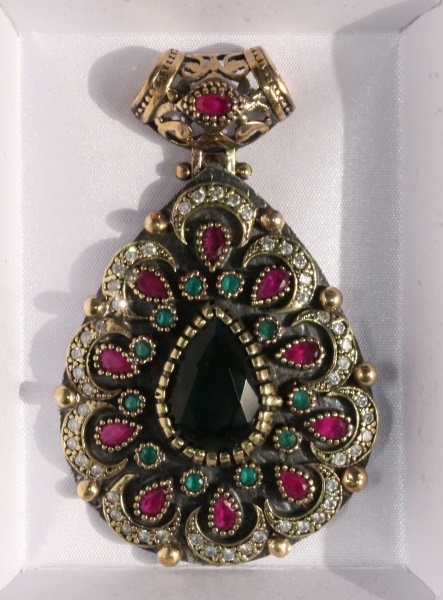STERLING SILVER GENUINE EMERALD AND RUBY PENDANT: STERLING SILVER GENUINE EMERALD AND RUBY PENDANT.