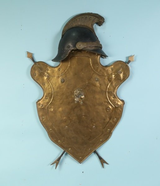 19th C. HAMMERED BRASS WALL ELEMENT OF SHIELD, SWORD: 19th CENTURY HAND HAMMERED BRASS WALL ELEMENT OF SHIELD, SWORD AND HELMET. Height: 33 in. by Width: 23 in. by Depth: 4 in.