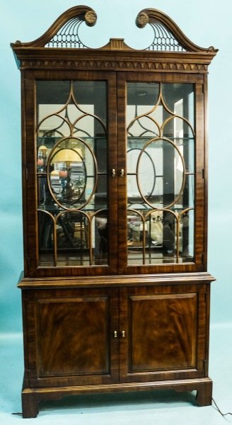 HENREDON CHIPPENDALE STYLE CHINA CABINET: HENREDON CHIPPENDALE STYLE CHINA CABINET WITH TWO PANED GLASS DOORS OVER TWO DOORS. ILLUMINATED INTERIOR. Height: 84 in. by Width: 39 in. by Depth: 15 in.