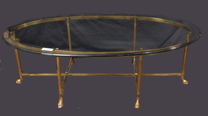 1970's GLASS TOP BRASS OVAL COFFEE TABLE: 1970's GLASS TOP BRASS OVAL COFFEE TABLE. Height: 17 in. by Width: 51 in. by Depth: 26 in.