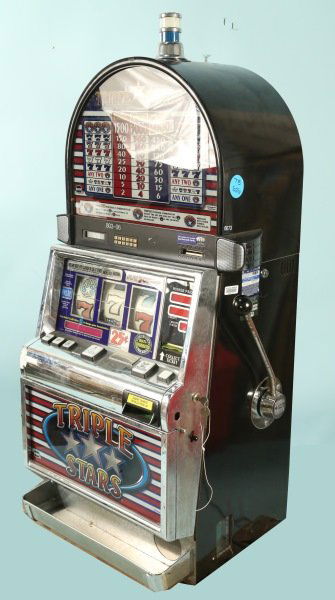 TRIPLE STAR BY I.G.T. SLOT MACHINE: TRIPLE STAR BY I.G.T. SLOT MACHINE. SERIAL NUMBER 1357798. Height: 53 in. by Width: 25 in. by Depth: 15 in.