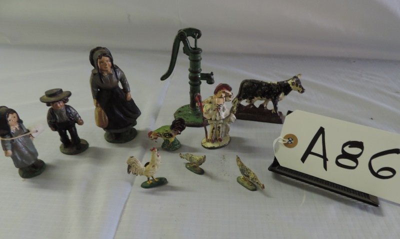 Lot of 10 cast iron fam toys: Cast iron - Amish woman, a boy and a girl. Little Bo Peep, Water pump. 4 chickens and 1 cow a86