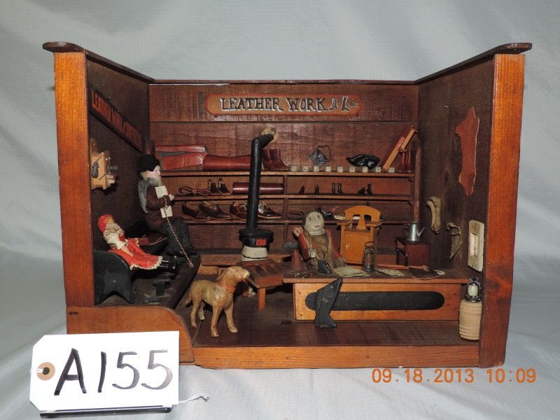 Diorama “Leatherwork Shop”: Diorama “Leatherwork Shop” with furnishings and pot belly stove. a155
