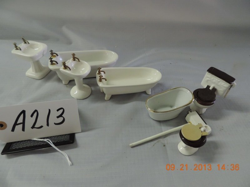 Ceramic doll house furniture: Ceramic doll house furniture: Bathroom: two pedestal sinks with brass fixtures; two claw foot tubs with gold toned fixtures; toilet with water tank and chain, toilet with wooden seat; small tub with s