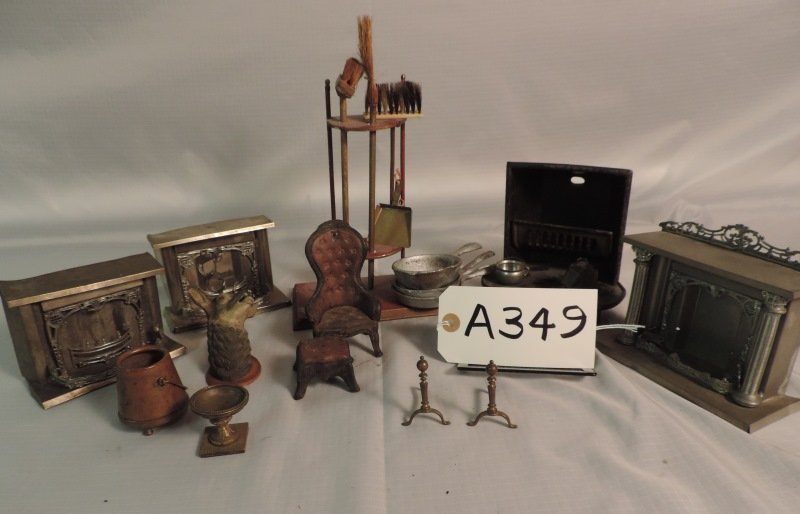 Mixed lot of doll furniture: Mixed lot of doll furniture: Fireplaces - 2 tin, silver metal and one large cast iron with hearth. Deer head, fireplace tools, cast iron chair and ottoman. Copper bucket.