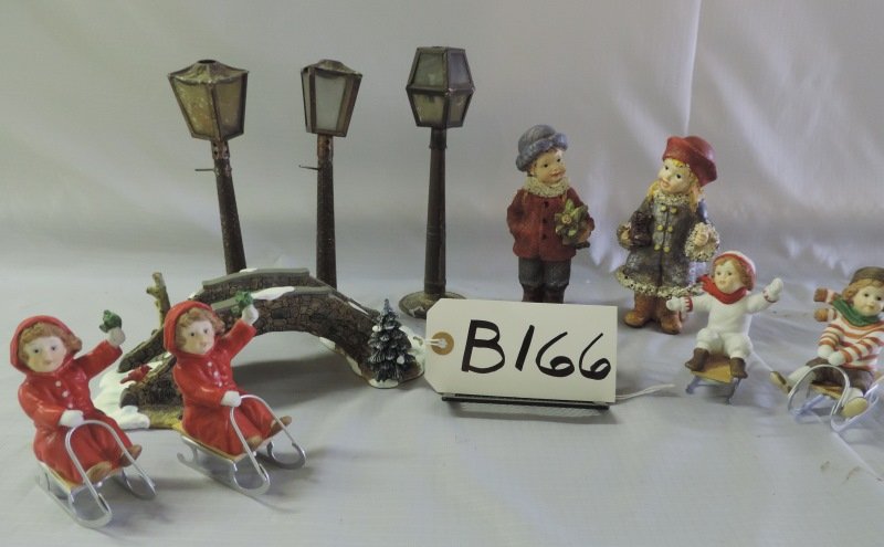 Christmas: Two Enesco children on sleds, small cec: Christmas: Two Enesco children on sleds, small ceramic bridge, three metal light posts, two children on sleighs, two ceramic children. B166
