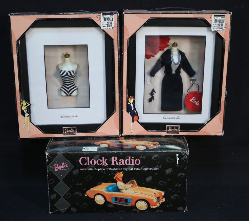 MIXED LOT THREE BARBIE PRODUCTS IN ORIGINAL BOXES: MIXED LOT OF THREE BARBIE PRODUCTS IN ORIGINAL BOXES. TWO BARBIE SHADOW BOXES (BATHING SUIT) & (COMMUTER SET SUIT), AUTHENTIC REPLICA OF BARBIE'S ORIGINAL 1962 CONVERTIBLE CLOCK RADIO. Height: 12 in. 