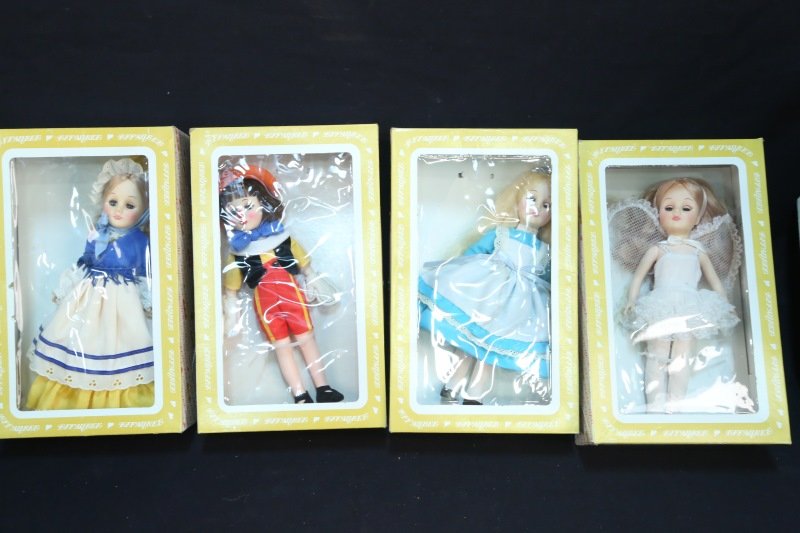 LOT OF FOUR EFFANBEE DOLLS: LOT OF FOUR EFFANBEE DOLLS. MOTHER GOOSE, PINOCCHIO, ALICE IN WONDERLAND, TINKERBELL. Height: 13 in. by Width: 8 in. by Depth: 4 in.