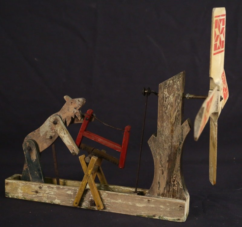 AMERICAN FOLK ART FARMER WHIRLY GIG: AMERICAN FOLK ART FARMER WHIRLY GIG. Wind catches the spinner which sets the farmer into sawing motion. Height: 15 in. by Width: 17 in. by Depth: 12 in.