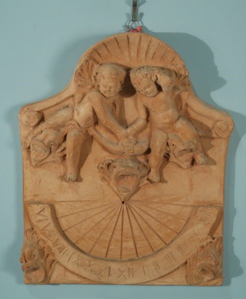 WALL MOUNT TERRACOTTA SUNDIAL: WALL MOUNT TERRACOTTA SUNDIAL. Height: 22 in. by Width: 17 in. by Depth: 2 in.