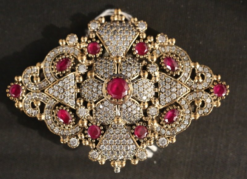 STERLING SILVER RUBY DIAMOND CZ BROOCH: STERLING SILVER RUBY DIAMOND CZ BROOCH. Height: 2 1/4 in. by Width: 3 1/8 in. by Depth: 1/4 in.