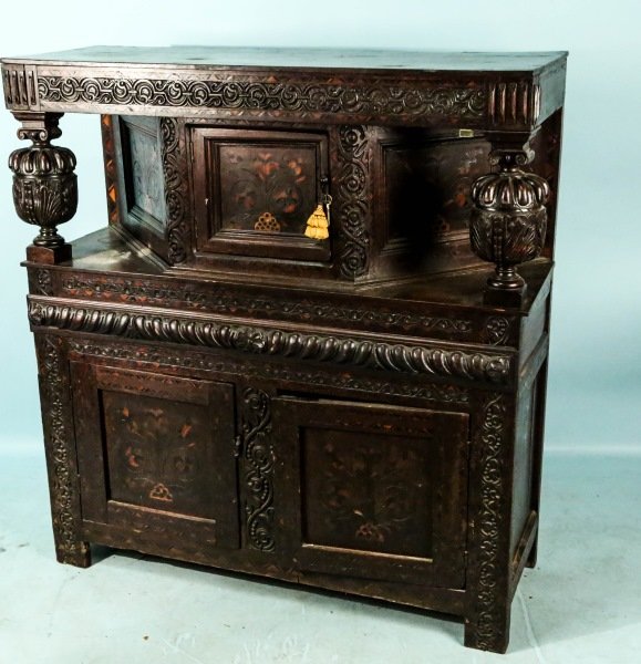 CIRCA 1550's ENGLISH OAK INLAID TUDOR CABINET: CIRCA 1550's ENGLISH OAK CARVED AND INLAID TUDOR CABINET. Height: 53 in. by Width: 49 in. by Depth: 17 in.