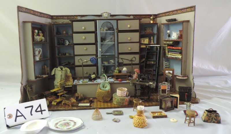 Few of a kind Diorama “Fabric Shop” with furn.: Few of a kind Diorama “Fabric Shop” with all the furnishings. A74 Height: 14.5 in. by Width: 28 in. by Depth: 11 in.