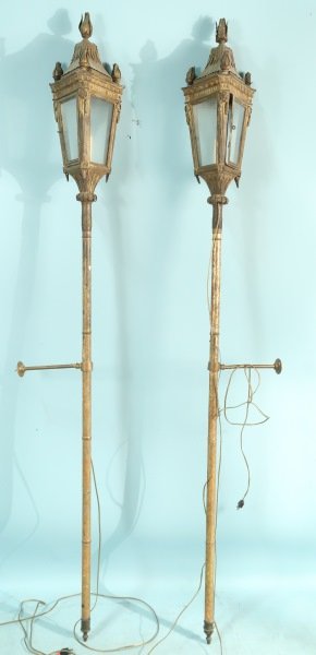PAIR OF 19th CENTURY VENITIAN TORCHIERES: PAIR OF 19th CENTURY VENITIAN TORCHIERES WITH GILDED WOODEN POLE AND IRON STRAPS. NOW ELECTRIFIED. Height: 80 in. by Width: 10 in. by Depth: 10 in.