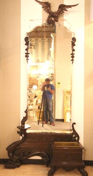 CIRCA 1880's RENAISSANCE REVIVAL PIER MIRROR: CIRCA 1880's BEAUTIFULLY CARVED AUSTRIAN RENAISSANCE REVIVAL WALNUT PIER MIRROR WITH A BEVELED MIRROR, CROWNED DRAGON AND COPPER LINED DRIP PAN. Height: 120 in. by Width: 54 in. by Depth: 15 in.