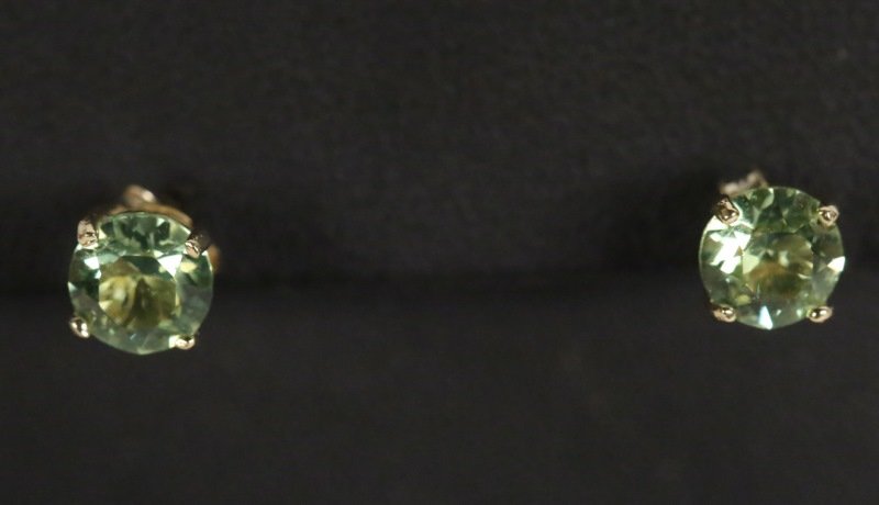 PAIR OF PERIDOT SOLITAIRE EARRINGS: PAIR OF PERIDOT SOLITAIRE EARRINGS.