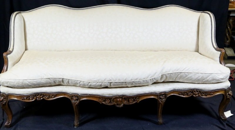 19th CENTURY FRENCH CANAPE: 19th CENTURY FRENCH CANAPE WITH CARVED SKIRT AND CABRIOLE LEGS IN BEIGE SATIN UPHOLSTERED SINGLE DOWN SEAT. Height: 39 in. by Width: 77 in. by Depth: 26 in.