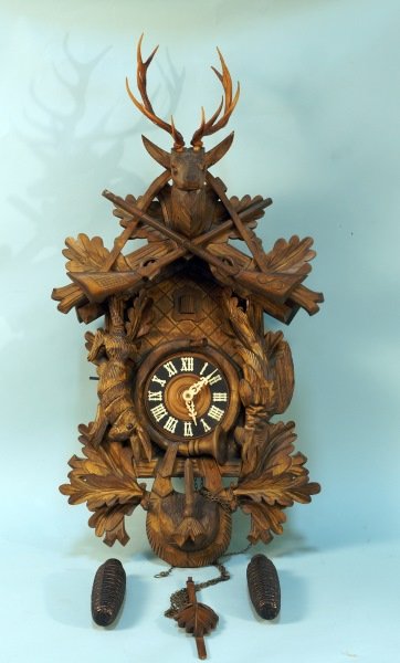 BLACK FOREST CUCKOO CLOCK: BLACK FOREST CUCKOO CLOCK. Height: 34 in. by Width: 17 in. by Depth: 7 in.