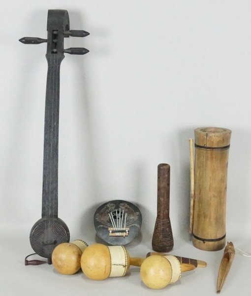 LOT OF NINE TRIBAL MUSICAL INSTRUMENTS: LOT OF NINE TRIBAL MUSICAL INSTRUMENTS. Height: 13 in. by Width: 14 in. by Depth: 14 in.