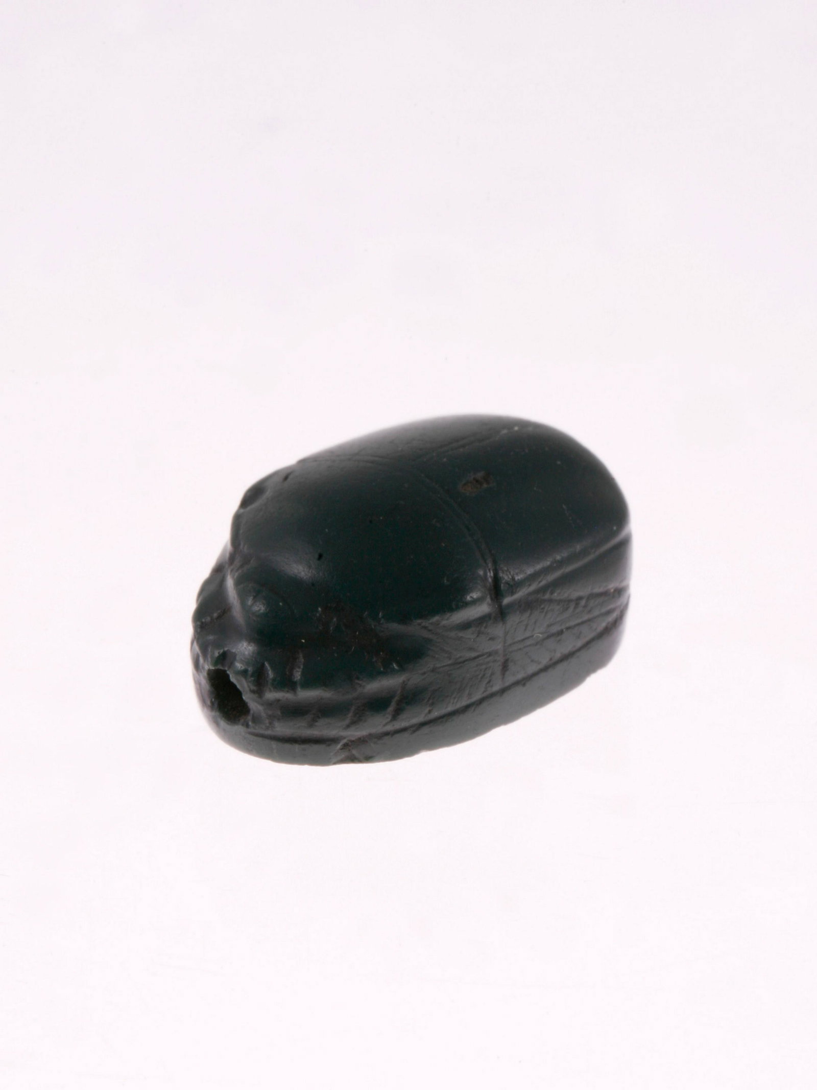An Egyptian Scaraboid: SKARABOID Ägyptisch Ohne Sockel / without base L 2 cm. Provenienz: Schweizer Privatsammlung, Zürich. CHF 50 / 100 EUR 43 / 86