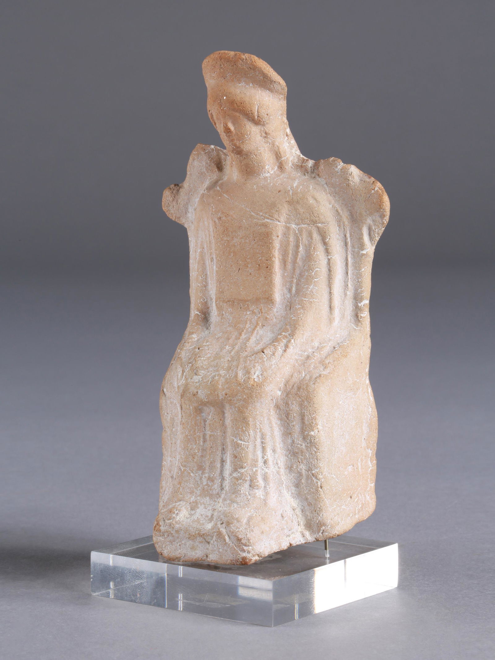 A Greek Enthroned Goddess: THRONENDE GÖTTIN Westgriechisch Mit Sockel / with base Keramik. H 13 cm. Provenienz: - Sammlung Ebnöther, Schweiz (zwischen 1960-1980). - Sammlung Wirtz. Mitte 5. Jh. v. Chr. September 2015 bei Drou
