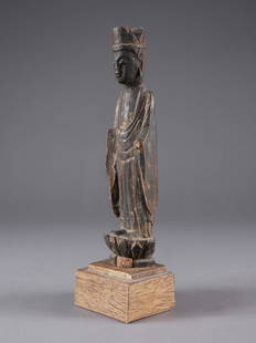 A Standing Buddha on a Lotus Pedestal: Stehender Buddha auf Lotus-Sockel Südasien Mit Sockel / with base Holz. H 30 cm. Provenienz: Schweizer Privatsammlung, Basel. Alle Objekte dieser Sammlung wurden anlässlich mehrerer