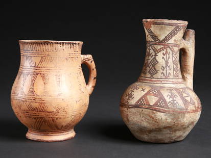 A Berber Jug and a Kabyle Jug, "tabuqalt": 2 Wasserkr&#252;ge, "tabuqalt" Berber, Kabylen, Algerien, Marokko, Rif Ohne Sockel / without base Terrakotta. H 15 - 18 cm. &#216; 11,5 - 12 cm. Provenienz: Christian Zingg (1956-2023), La Chaux-de-Fo