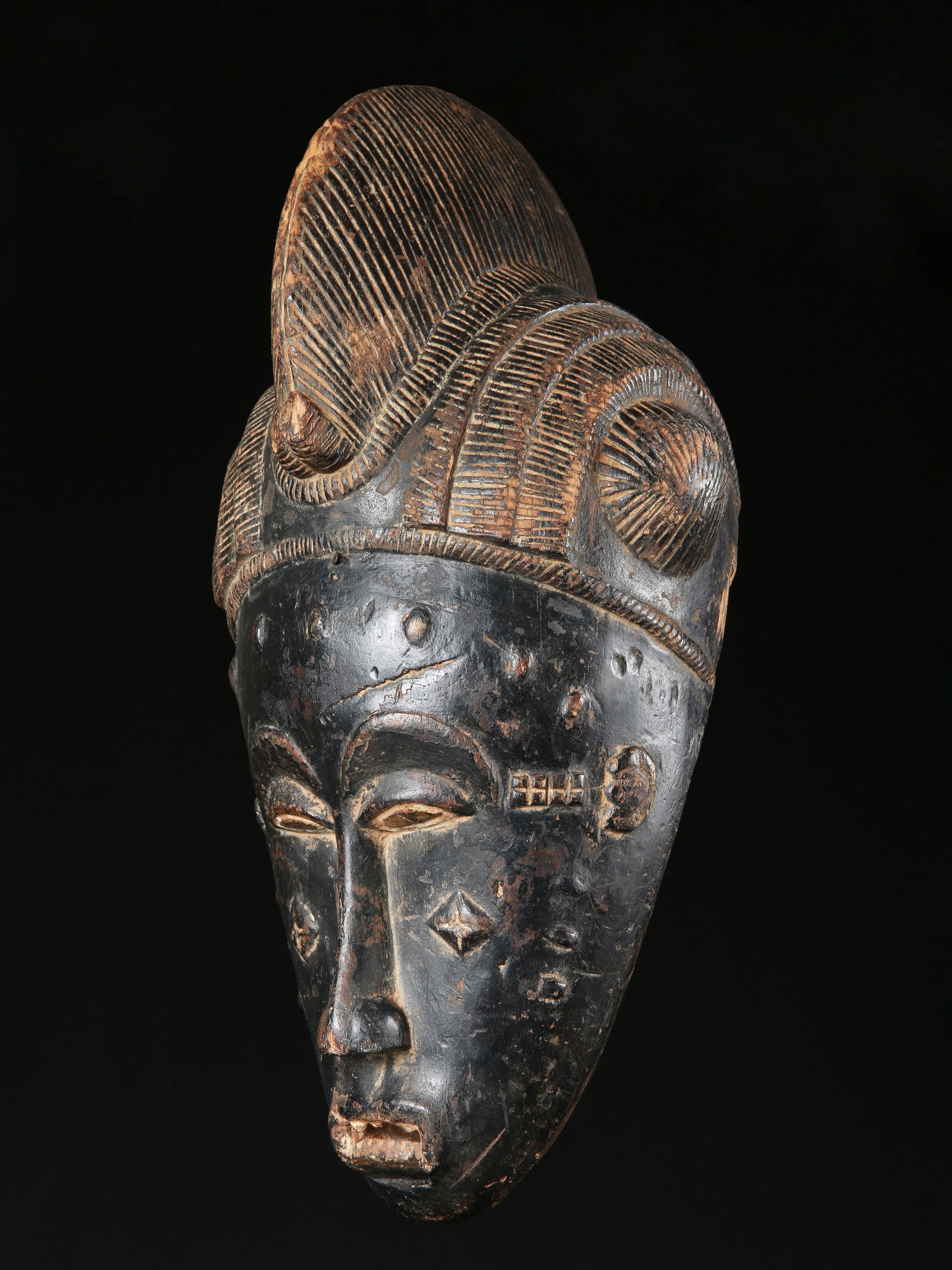 A Baule Mask, "mblo" (1 of 6)