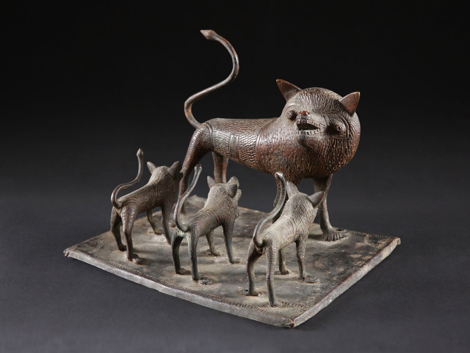 A Fon Altarpiece, Group of four Bronze Lions (1 of 11)