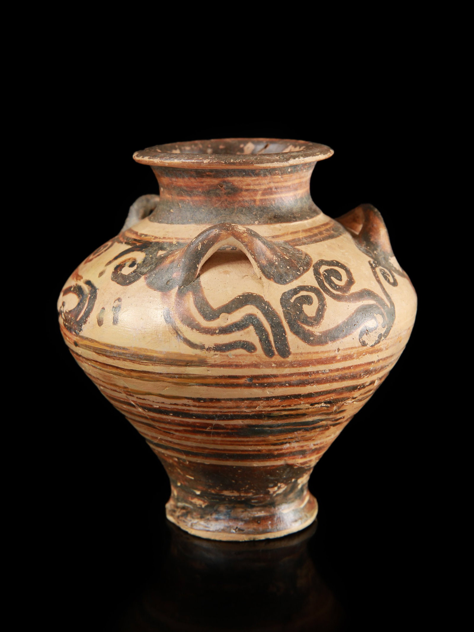 A Mycenaean Three-Handled Amphoriskos: Mykenischer dreihenkliger Amphoriskos Ohne Sockel / without base Terrakotta. H 9 cm. B 7,5 cm. Provenienz: - Familie Leonhard, Grosseltern von Ulf Leonhard. - Ulf Leonhard, Geislingen. - Hans Susemihl