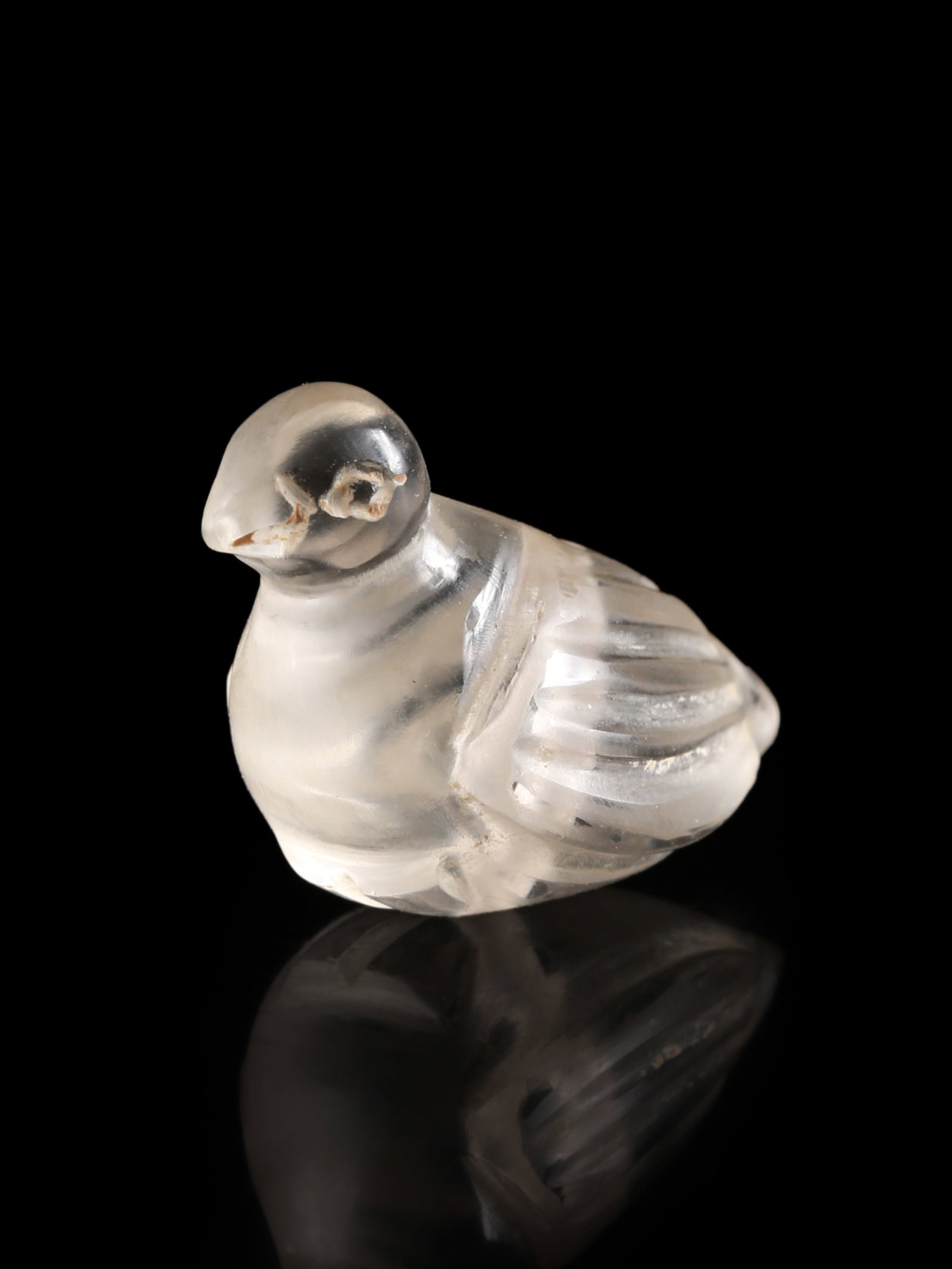 A Roman or Byzantine Rock Crystal Microsculpture of a Dove: Römische oder Byzantinische Mikroskulptur einer Taube Ohne Sockel / without base Bergkristall. H 2 cm. B 2,5 cm. Provenienz: - Gerhard Hirsch Nachfolger, München, Auktion 265, 09.02.2010, Lo