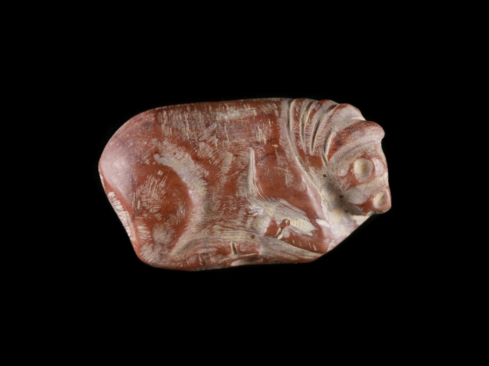 A Near Eastern Stone Amulet in the Shape of reclining Bull (1 of 5)