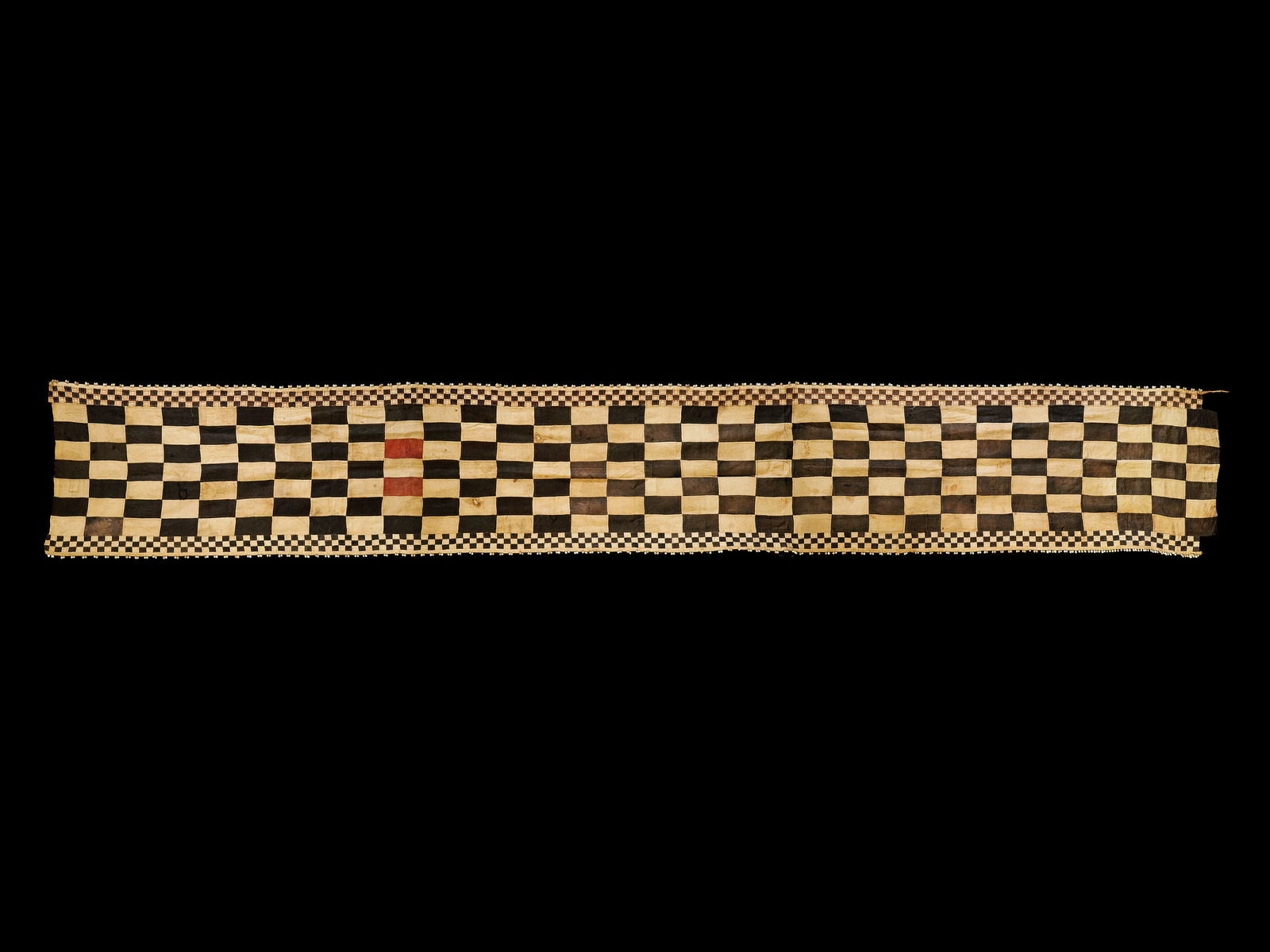 A Kuba Woven Fabric, ceremonial Overskirt, "ntchak": Wickelgewand, "ntchak" Kuba, Bushoong. DR Kongo Ohne Sockel / without base Raphia. B 87 cm. L 600 cm. Provenienz: - Galerie Walu, Basel. - Hammer Auktionen, Basel (16.05.2018, Lot 57). - Claudine (195