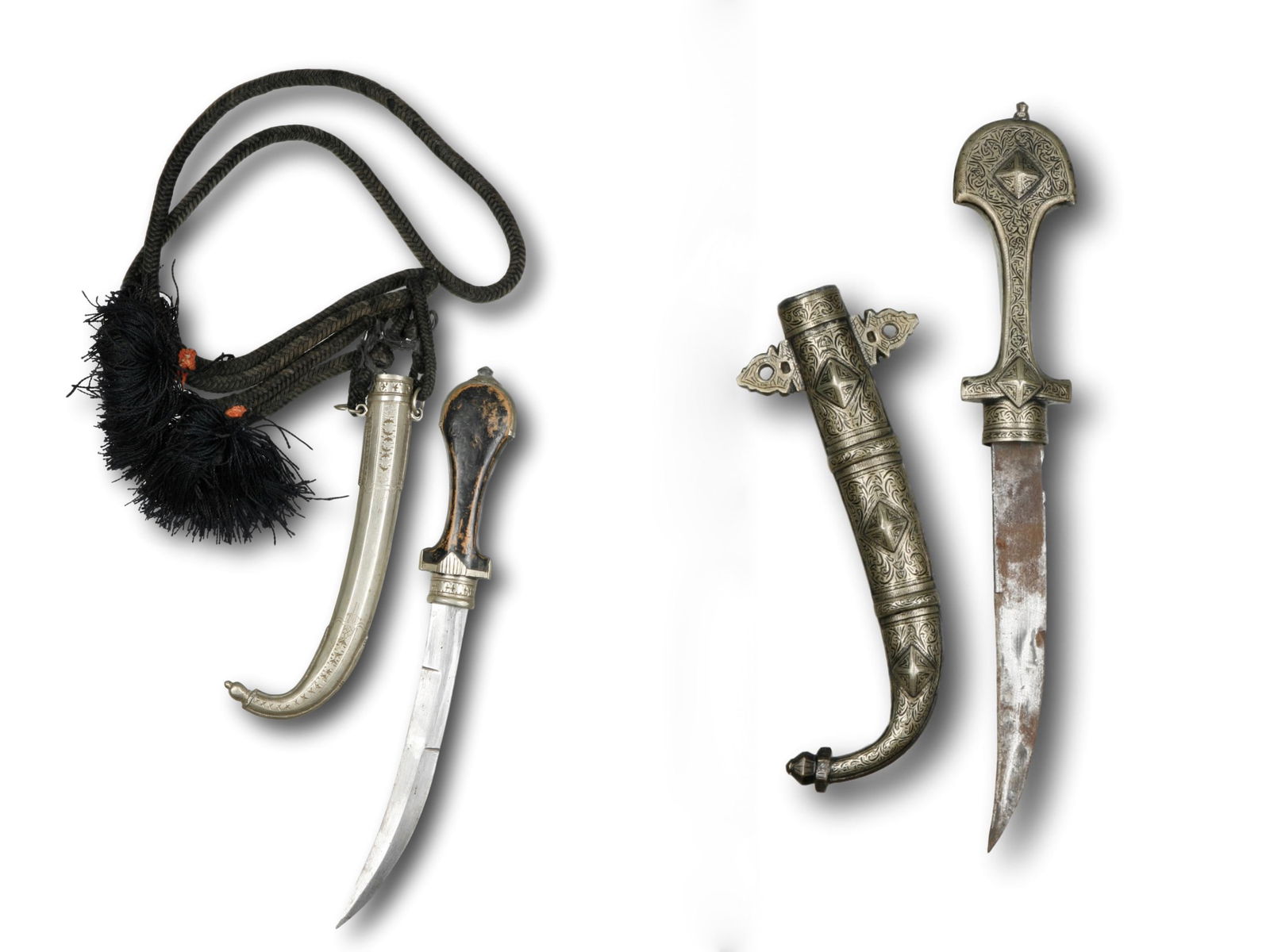 2 Moroccan Daggers with Sheath, "koummya": 2 Dolche mit Scheiden, "koummya" Marokko Ohne Sockel / without base Holz, Eisen, Silber, Schnur, Textil. L 38,5 - 40 cm. Provenienz: - Kurt Hösli-Brutschin (1928-2006), Basel. - Hammer Auktionen,