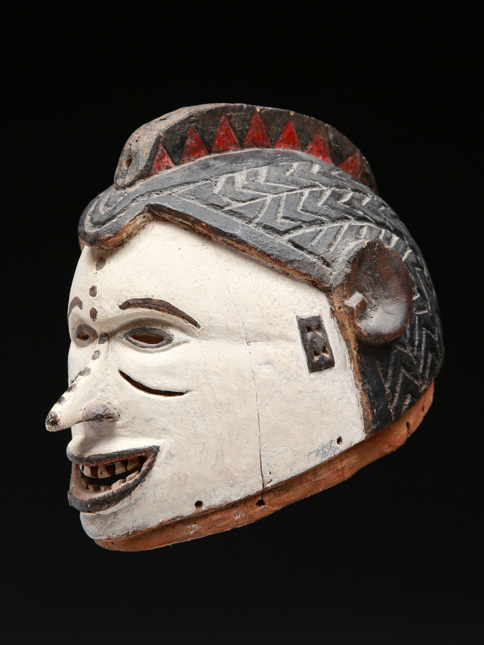 An Igbo Helmet Mask, "agbogho-mmwo" (1 of 12)