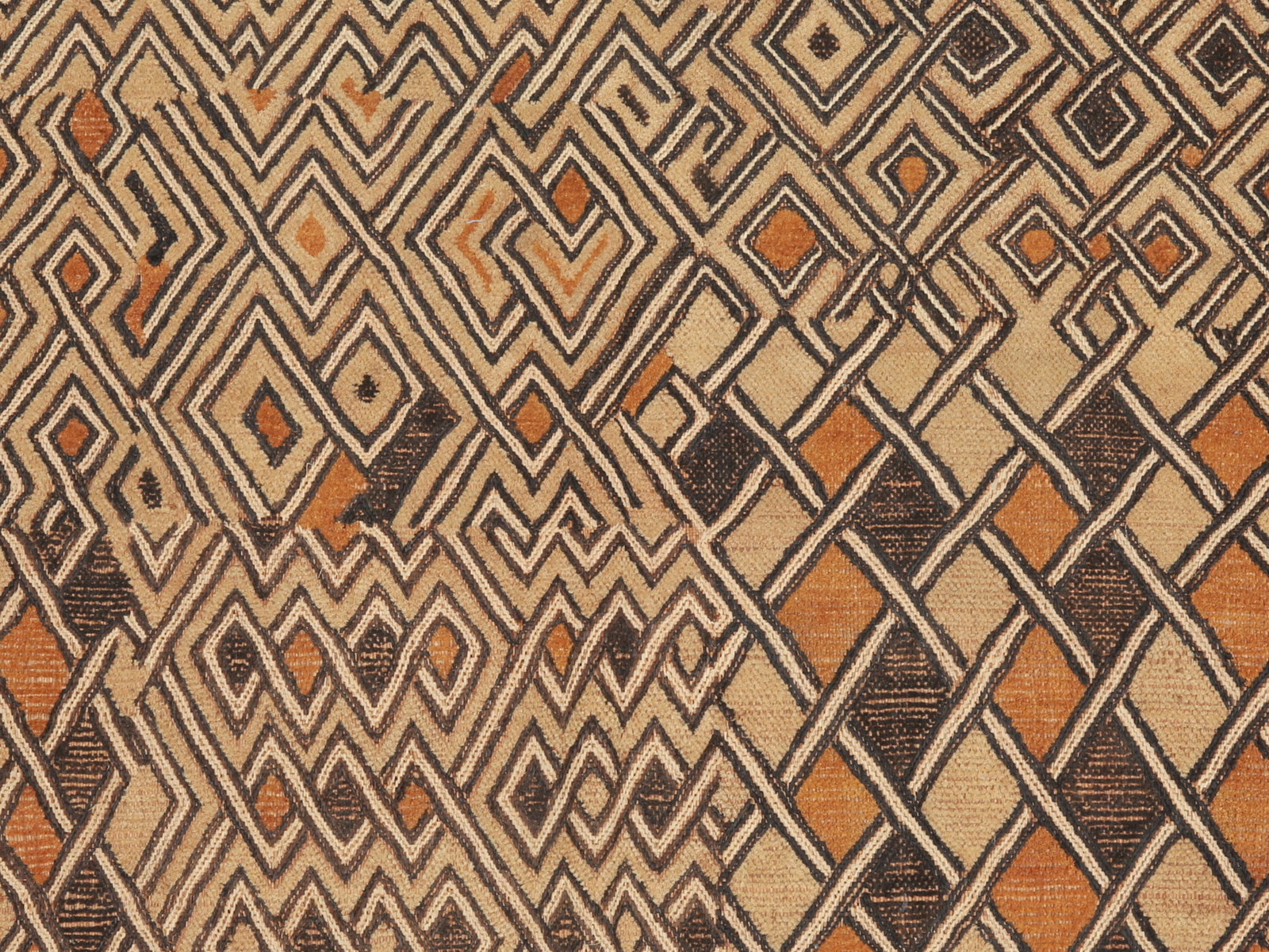 A Shoowa Embroidered Raffia Textile Panel, "mbal": Raphia-Plüschgewebe, "mbal" Kuba / Shoowa. DR Kongo Ohne Sockel / without base Raphia. B 45 cm. L 57 cm. Provenienz: Laurence und Jean-Pierre Boillod (1929-2007), Areuse. Eine bemerkenswerte
