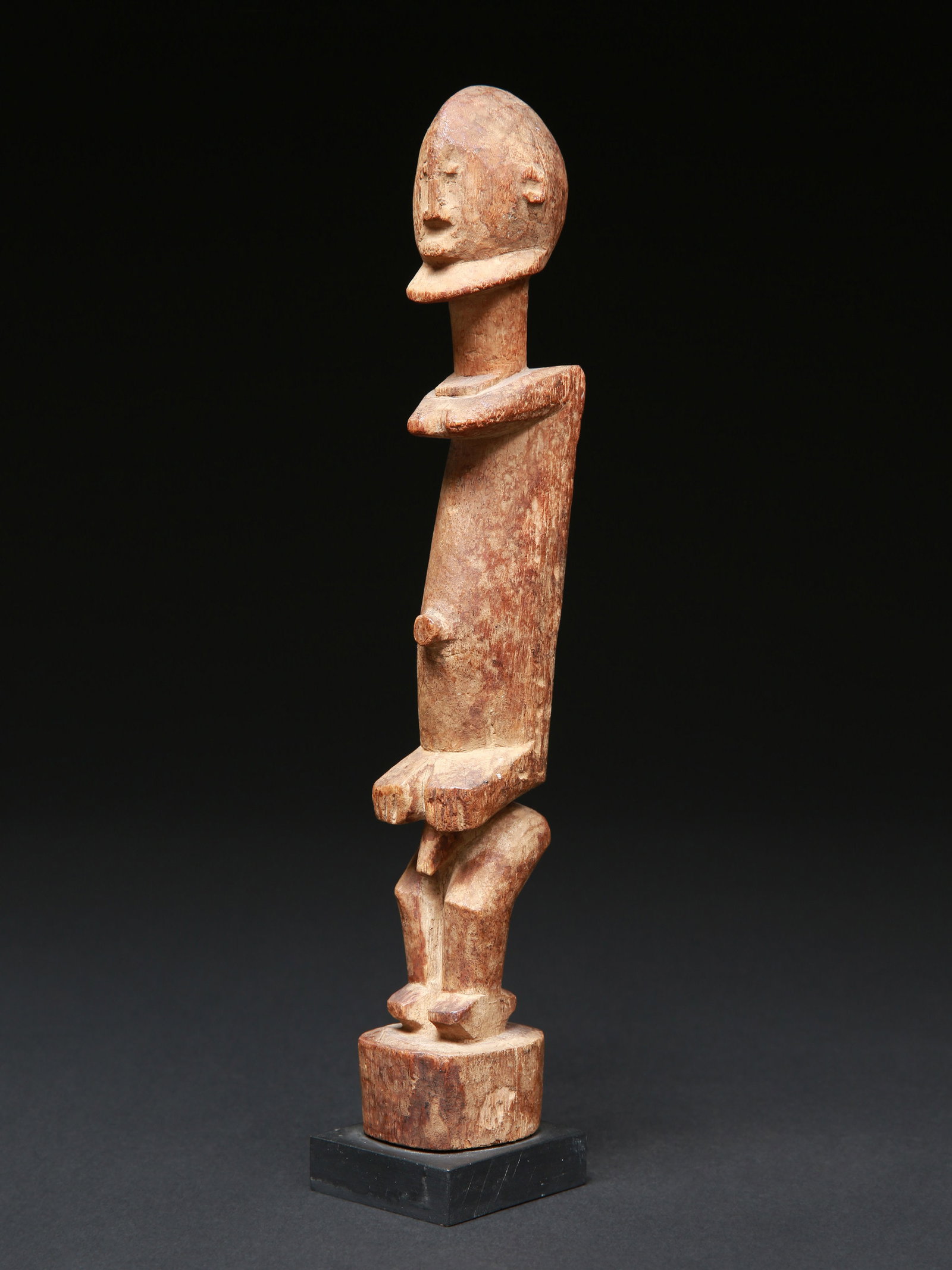 A Dogon Figure (Staff Finial?): Figur (Staboberteil?) Dogon. Mali Mit Sockel / with base Holz. H 28 cm. Provenienz: - Galerie Maria und Paul Wyss, Maria Wyss (1924-1992), Basel. - Schweizer Privatsammlung, Basel. - Hammer Auktionen,