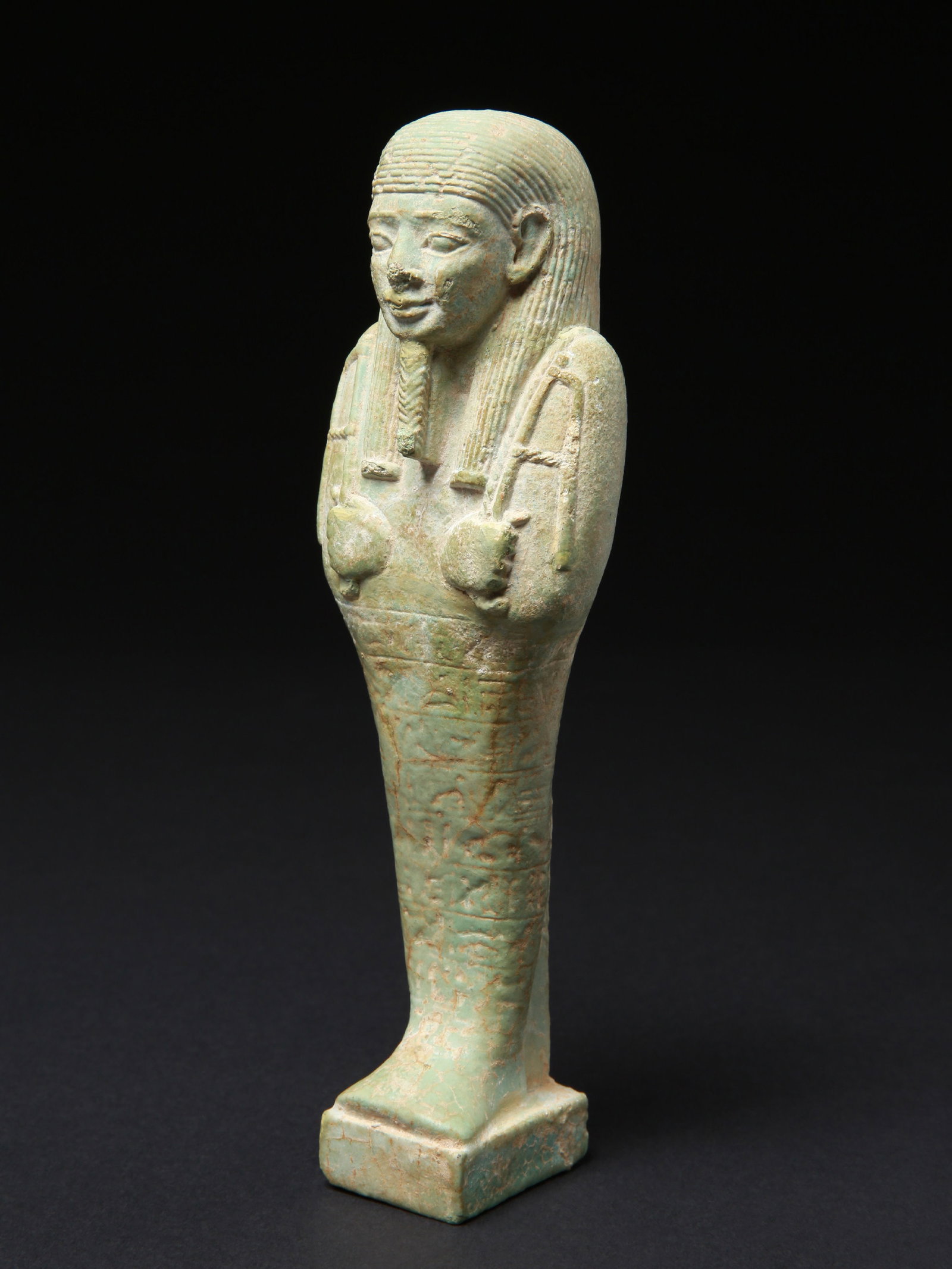 An Egyptian Faience Ushabti: Uschebti Ägypten Ohne Sockel / without base Ägyptische Fayence. H 20,5 cm. Provenienz: Schweizer Privatsammlung, Basel. CHF 200 / 400