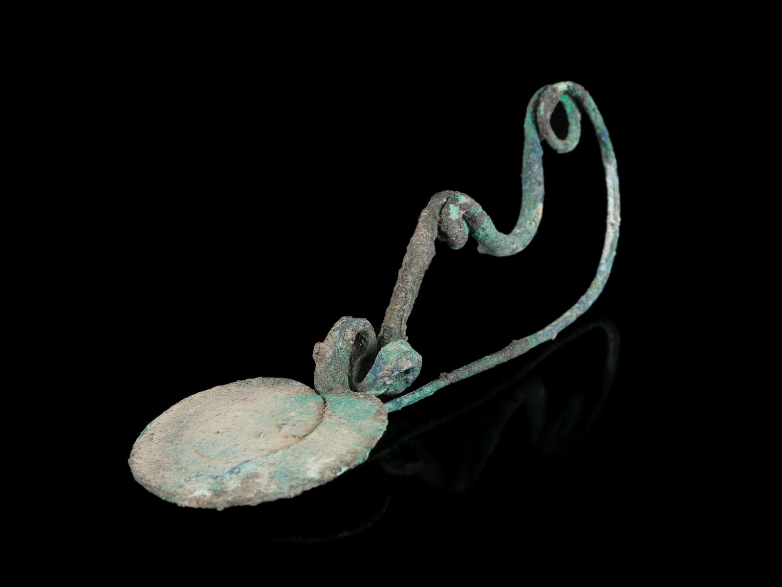 An Italic Disc-Type Fibula: Scheibenfibula Italisch Ohne Sockel / without base Kupferlegierung. H 4 cm. B 3,5 cm. L 11,5 cm. Provenienz: - Sammlung Odermatt, Zürich, 1970er-1980er Jahre. - Gorny & Mosch, München (05.07