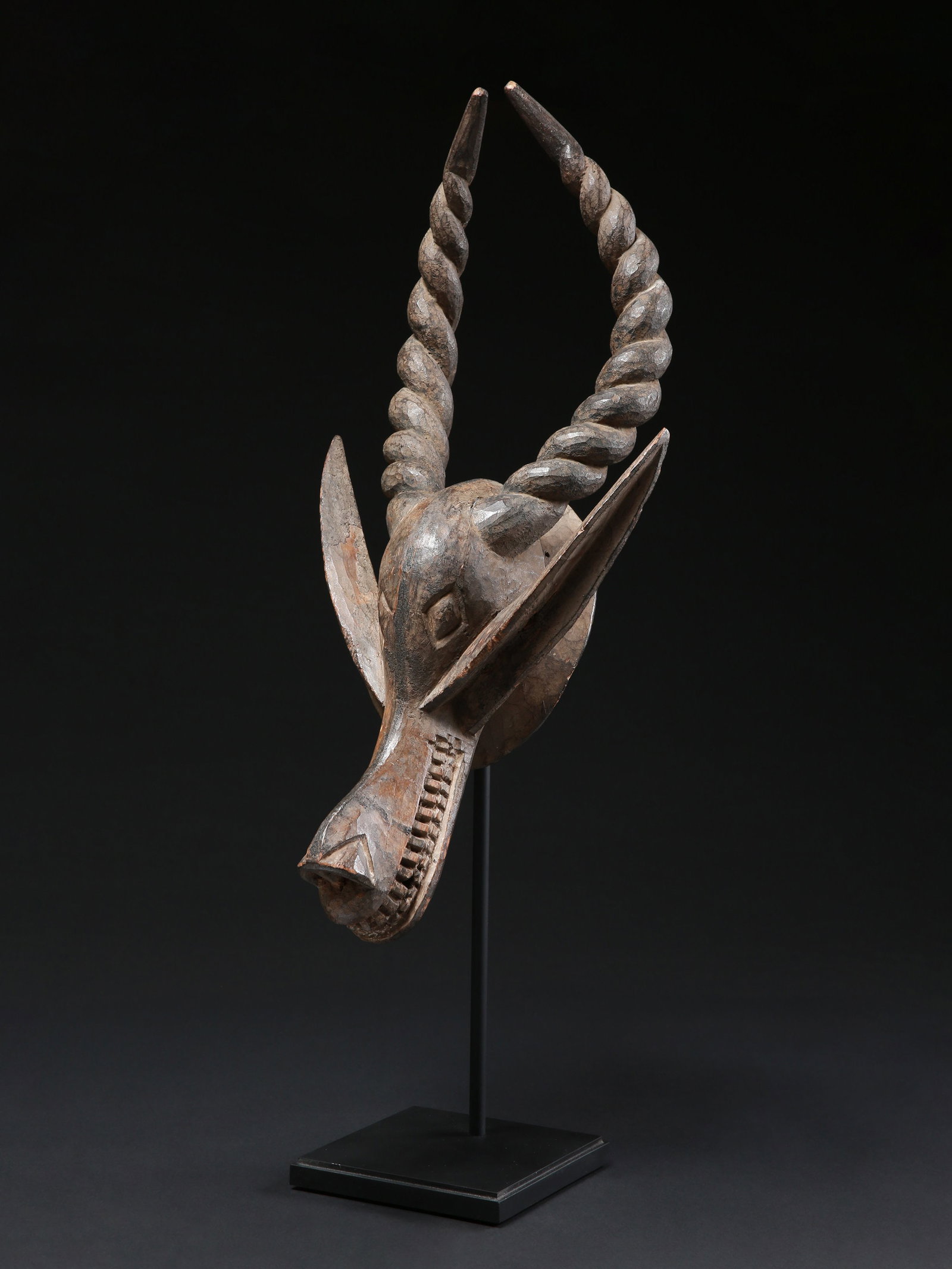 An Yoruba-Ijebu Mask representing an Antelope, "agira agbo": Antilopenmaske, "agira agbo" Yoruba-Ijebu. Nigeria Mit Sockel / with base Holz. H 64 cm. B 31 cm. Provenienz: - René David (1928-2015), Zürich. - 2015: Jean David, Basel. Ausgestellt: Mus