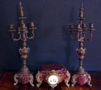 RED MARBLE THREE PC PEDESTAL CLOCK SET 11982A: Amazing three piece French Rococo pedestal clock set on rouge marble base. Dimensions: 6'H x 10.5"W x 9"D (clock) sides: 26"H x 9"W Age: C. 1890 Material: Bronze & Marble